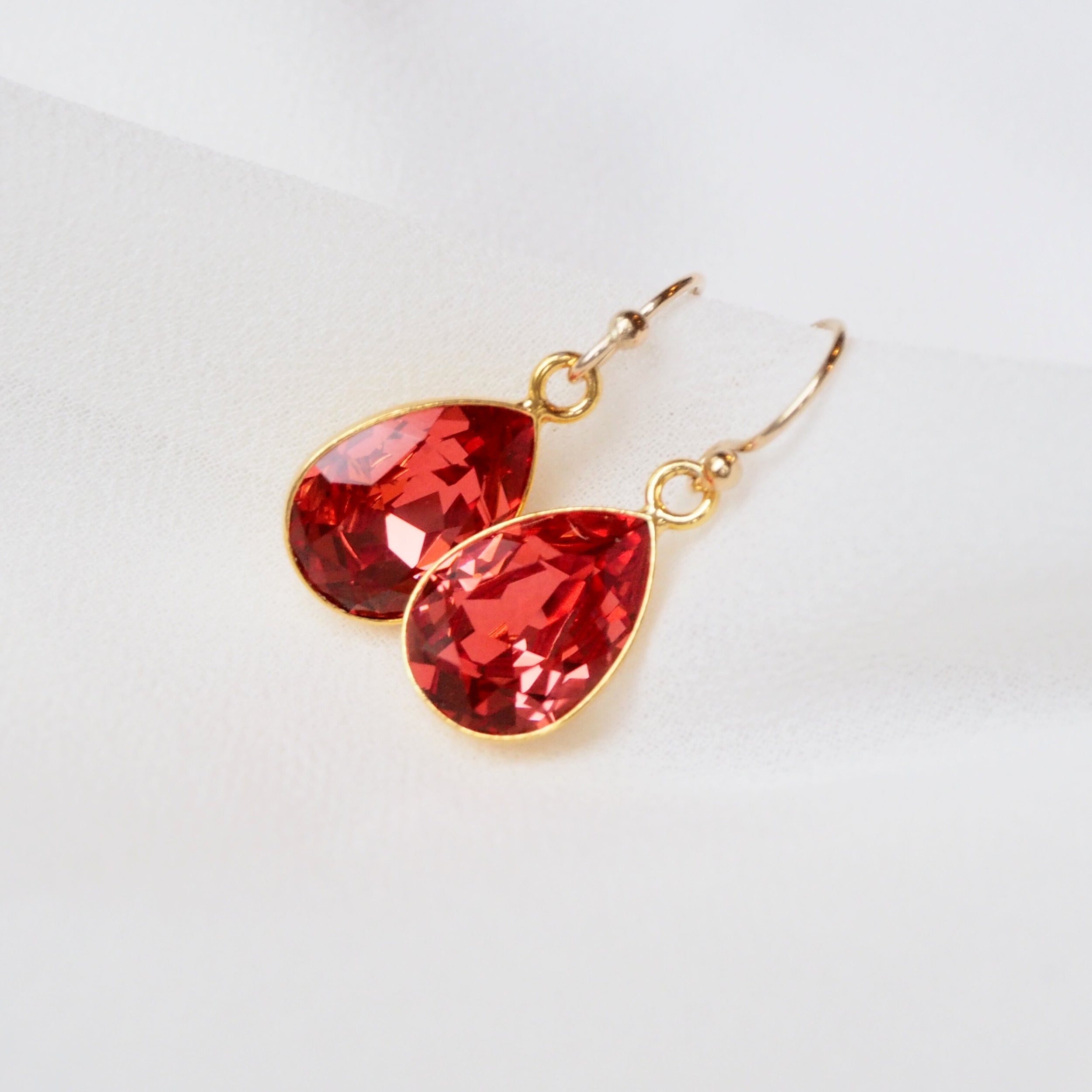 Oorbellen ontworpen met Swarovski druppels in Padparadscha - Jewels with Flair