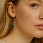 Lange oorbellen met onyx druppels groen