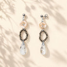 Lange oorbellen pyriet en swarovski druppels